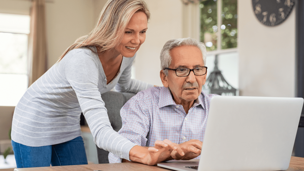 helping elderly dad with the laptop
