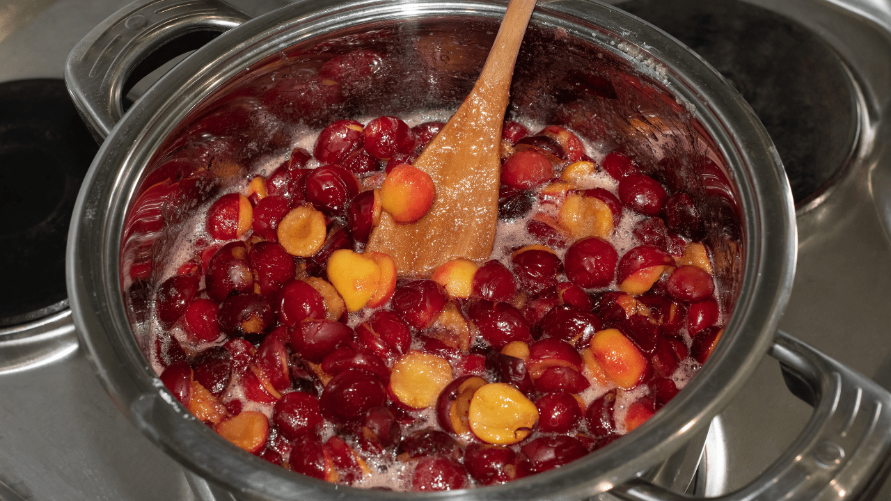 plum jam stirring